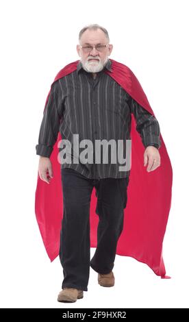 In vollem Wachstum. Reifer Mann in einem Superhelden Cape Schritt nach vorne. Stockfoto