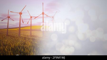 Zusammensetzung von Windenergieanlagen auf dem Land mit Rauchabschirmung Stockfoto