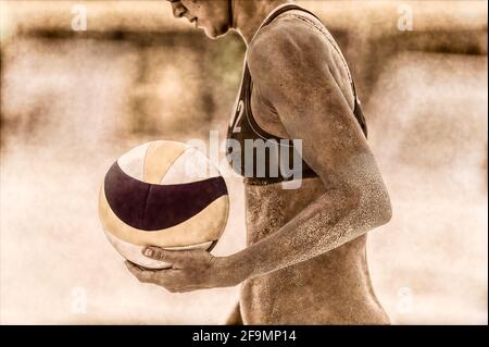 Eine weibliche Beach Volleyball-Spieler ist immer bereit, den Ball zu dienen Stockfoto