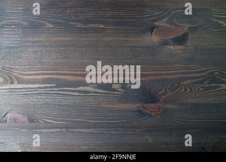 Draufsicht auf dunkelbraune natürliche Holzplanke als Hintergrund Und Hintergrundbild Stockfoto