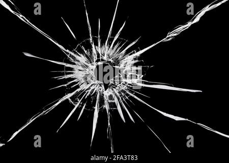 Die Textur von Rissen auf dem Glas mit dem Effekt Von einem Schuss am Fenster Stockfoto