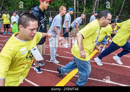 Florida North Miami FIU Campus Special Olympics Summer Games, geistig Behinderte Startlinie Fuß Rennen Mann Männer, Stockfoto