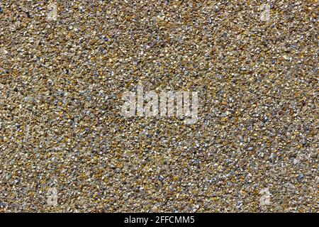 Kieselsteinstrich-Textur an einer Außenwand Stockfoto