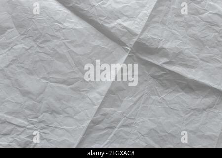 Weißer, faltiger und gefalteter Papiertextur-Hintergrund Stockfoto