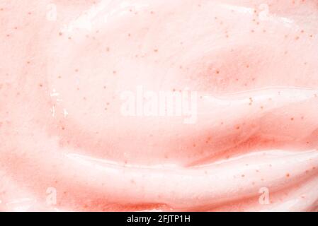Die Textur eines Peeling oder Duschgels auf einem rosa Hintergrund. Stockfoto