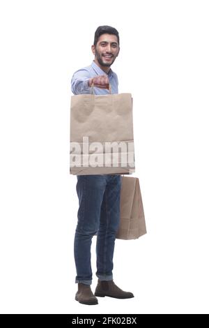 Junger Mann mit großen Papier-Einkaufstaschen. Stockfoto