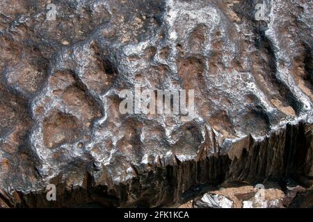 Souvenirjäger Zuschnitte aus Eisen abseits der Hoba Meteorit, der größte bekannte Meteorit auf der Erde, liegt auf einem Bauernhof in der Nähe von Grootfontein, Namibia. Stockfoto