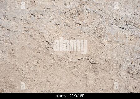 Betongrauer Hintergrund, Draufsicht. Fehlerhafte Zementestriche. Stockfoto