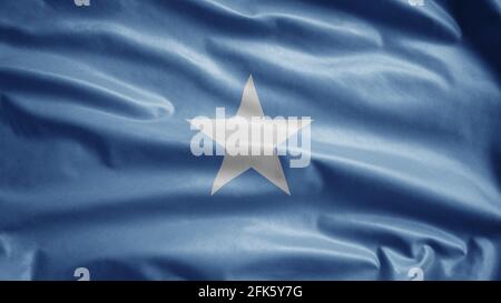 Somalische Flagge winkt im Wind. Nahaufnahme eines Somali-Banners, weiche und glatte Seide. Stoff Stoff Textur Fähnrich Hintergrund. Stockfoto