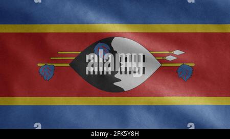 Swasiland-Flagge winkt im Wind. Nahaufnahme des Eswatini-Banners, weiche und glatte Seide. Stoff Stoff Textur Fähnrich Hintergrund. Stockfoto