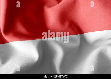 3D Illustration Flagge von Indonesien. Winken auf dem textilen Hintergrund der Windfahne Stockfoto