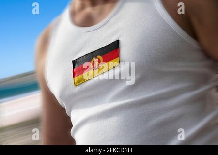 Die Nationalflagge der DDR auf der Brust des Sportlers Stockfoto