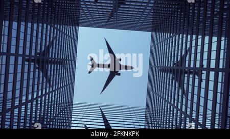 Das Flugzeug fliegt über moderne Wolkenkratzer vor einem wunderschönen blauen Himmel. 3d-Rendering Stockfoto