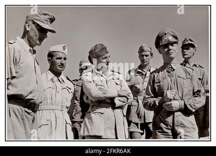 2. Weltkrieg ROMMEL AFRIkaCORPS OFFIZIERSGRUPPE General Johannes Erwin Eugen Rommel (15. November 1891 – 14. Oktober 1944) war ein nationaldeutscher General und Militärtheoretiker. General Rommel, bekannt als Wüstenfuchs, war ein angesehener Kommandant des Afrikakorps-1941 - Generalleutnant Erwin Rommel (Kommandierender General Deutsche Afrikakorps) in Tripolis (Libyen), als er 1941 nach Nordafrika kam. Zweiter Weltkrieg Stockfoto