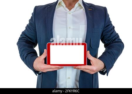 Der Mann im Anzug hält die rote Tablette mit beiden Händen Stockfoto
