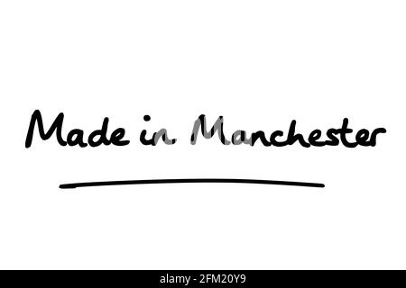 Hergestellt in Manchester, handgeschrieben auf weißem Hintergrund. Stockfoto