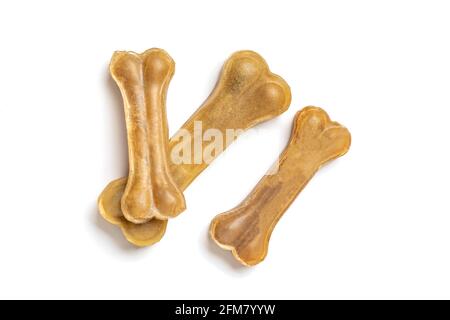 Knochen für Hunde isoliert auf weißem Hintergrund Draufsicht flach Lay Delicious Leckerbissen für Ihr geliebtes Haustier Futter für Tiere Konzept Stockfoto