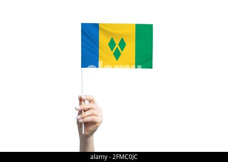 Schöne weibliche Hand mit der Flagge von St. Vincent und den Grenadinen, isoliert auf weißem Hintergrund. Stockfoto