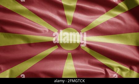 Mazedonische Flagge winkt im Wind. Nahaufnahme des Banners aus Nord-Mazedonien, weiche und glatte Seide. Stoff Stoff Textur Fähnrich Hintergrund. Stockfoto