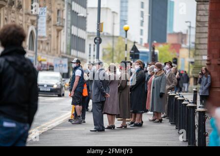 Extras am Set des Farbraums, das gerade gefilmt wird In Birmingham für Sky Stockfoto