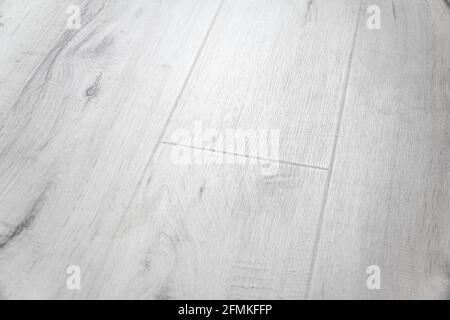 Laminatboden Hintergrundstruktur. Laminatboden-Paneele im Muster. Laminathintergrund. Holzlaminat- und Parkettbretter für den Boden Stockfoto