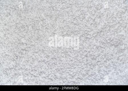 Abstrakter weißer Hintergrund. Raue Textur. Putz an der Wand. Stockfoto