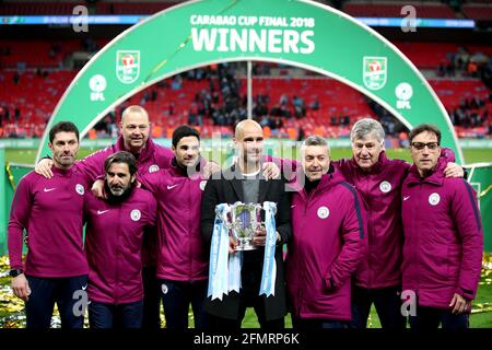 File photo dated 25-02-2018 of Manchester City Manager Pep Guardiola (Mitte) celebrates with coaching staff includes Domenec Torrent (third right), Lorenzo Buenaventura (third left), Mikel Arteta (vierter links), Xabier Mancisidor (left), and Brian Kidd (second right) during the Carabao Cup Final at Wembley Stadium, London. Ausgabedatum: Dienstag, 11. Mai 2021. Stockfoto