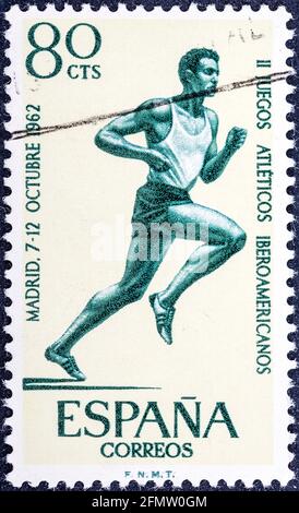 SPANIEN - UM 1962: Briefmarke gedruckt von Spanien, zeigt Läufer bei Iberoamerikanischen Sportspielen, um 1962 Stockfoto