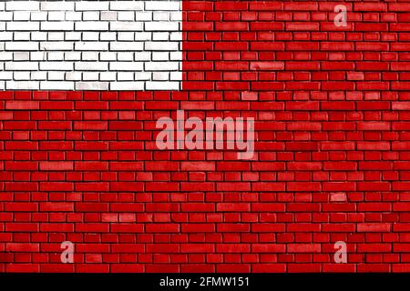 Flagge von Abu Dhabi auf Ziegelmauer gemalt Stockfoto