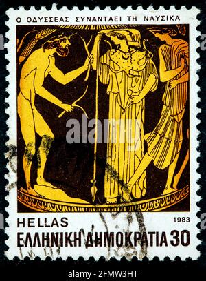 GRIECHENLAND - UM 1983: Eine in Griechenland gedruckte Briefmarke aus der Ausgabe 'Homeric Epics' zeigt Odysseus auf Nausicaa, um 1983. Stockfoto