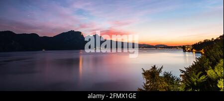 Ein herrlicher Sonnenuntergang über dem Vierwaldstättersee. Lichter der Stadt. Gipfel des Pilatus. Schweiz. Stockfoto