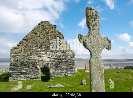 Kilnave Chapel and Cross befindet sich am Westufer des Loch Gruinart, Isle of Islay, Inner Hebrides, Schottland. Stockfoto