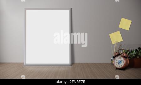 Holzschreibtisch mit Fotorahmen und minimalistischer runder Vase mit Ein dekorativer Zweig an der weißen Wand Stockfoto