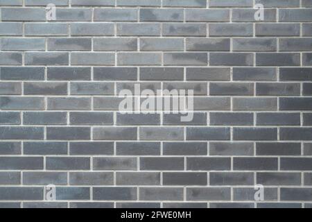 Graue rustikale Ziegelwand - hochwertige Textur. Hintergrund für Ihre Projekte und kreative Arbeit. Stockfoto