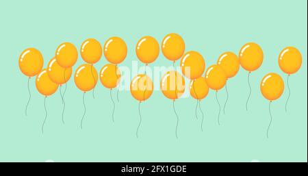 Zusammensetzung von mehreren gelben Ballons auf grünem Hintergrund Stockfoto