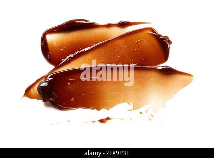 Schokoladenfarbener Gel-Abstrich und -Textur. Kosmetisches Gel oder Karamellsirup auf weißem Hintergrund Stockfoto