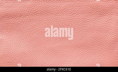 Nahaufnahme einer detailreichen rosa Kunstlederoberfläche. Hochauflösender texturierter Hintergrund im Vollformat. Stockfoto