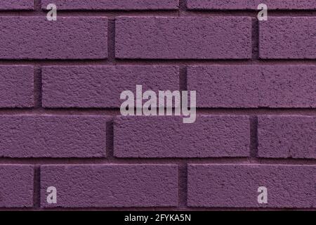 Nahaufnahme von gemalten lila Backstein Wand Textur Hintergrund. Stockfoto