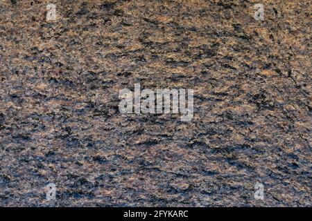 Grauer und brauner Stein Granit strukturierte abstrakte Wand Hintergrund. Stockfoto