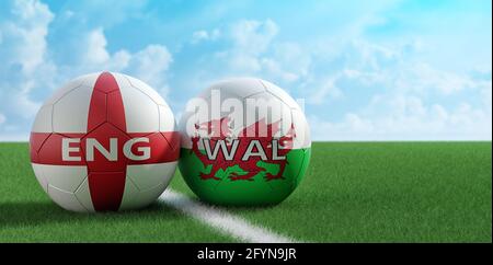 Wales vs. England Soccer Match - Lederbälle in Wales und England Nationalfarben auf einem Fußballfeld. Platz auf der rechten Seite kopieren - 3D-Rendering Stockfoto