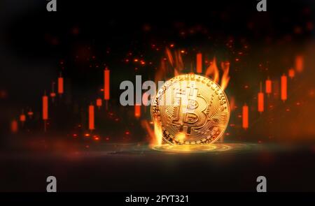 Brennendes Gold Bitcoin im Handel Aktienchart auf schwarzem Hintergrund. Stockfoto
