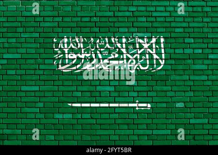 Flagge Saudi-Arabiens auf Ziegelmauer gemalt Stockfoto