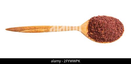 Draufsicht auf Holzlöffel mit isoliertem gemahlenem Sumac Weißer Hintergrund Stockfoto