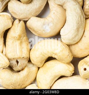 Quadratische Lebensmittel Hintergrund - rohe Cashew-Samen aus nächster Nähe Stockfoto