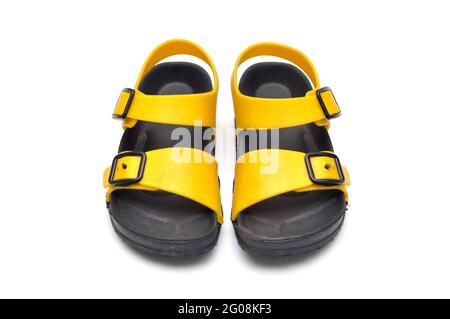 Schwarze und gelbe Kinder-Sandalen aus Gummi Stockfoto