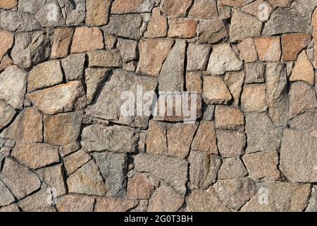 Steinwand aus Granit, Nahaufnahme, Textur, Hintergrund Stockfoto