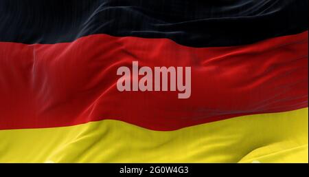 Detail der Nationalflagge Deutschlands, die im Wind fliegt. Demokratie und Politik. Europäisches Land. Stockfoto