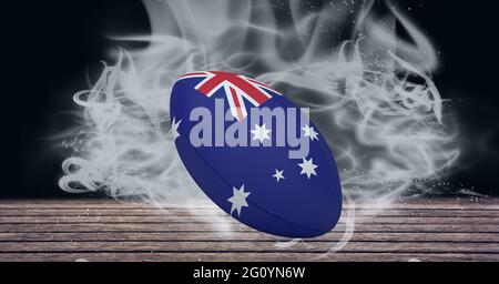 Komposition von Rugby Ball der australischen Flagge auf schwarzem Hintergrund mit weißem Rauch Stockfoto