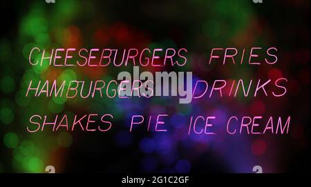 Hamburger-Diner-Menü im Pink Neon-Restaurant im Regenfenster Stockfoto