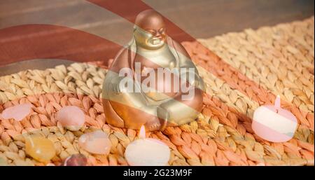 Komposition einer buddha-Figur über der amerikanischen Flagge Stockfoto